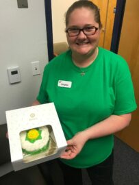 Eye Specialists of Mid-Florida team member with a cake